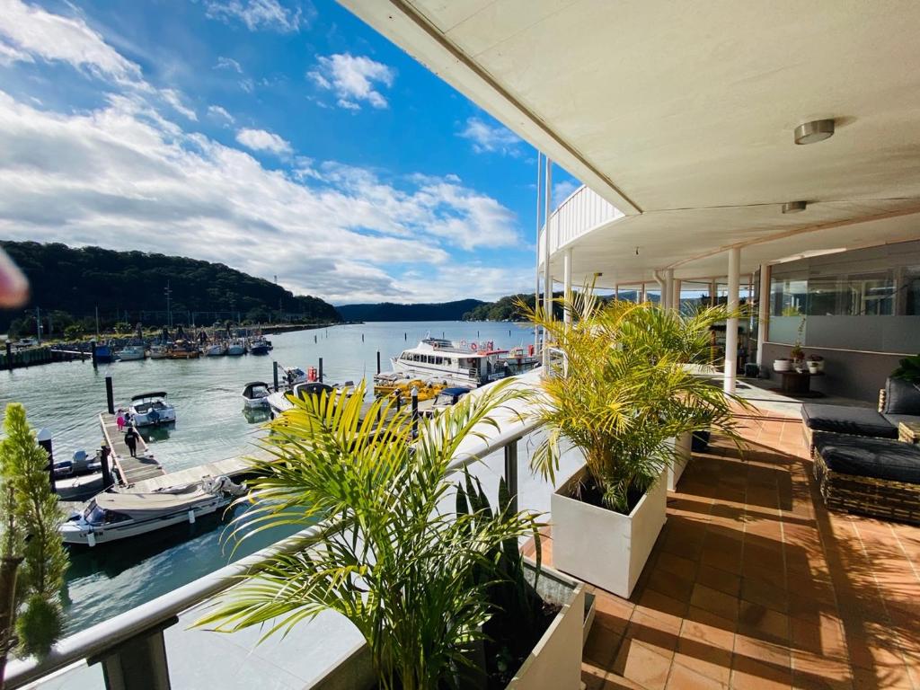 a view of a marina with boats in the water at Jewel of Brooklyn - Hawkesbury River Marina in Brooklyn