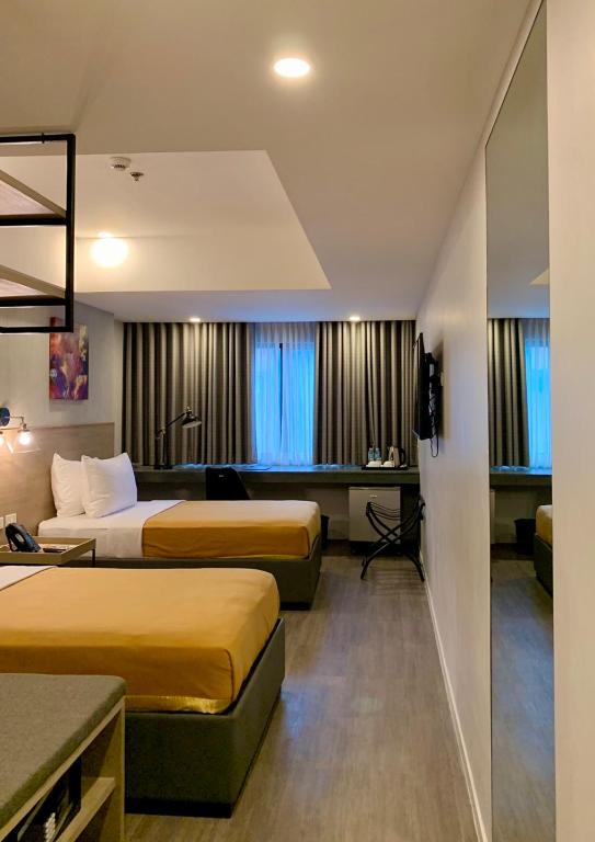 Postel nebo postele na pokoji v ubytování JET Hotel