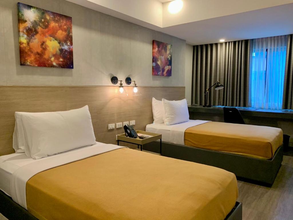 Postel nebo postele na pokoji v ubytování JET Hotel