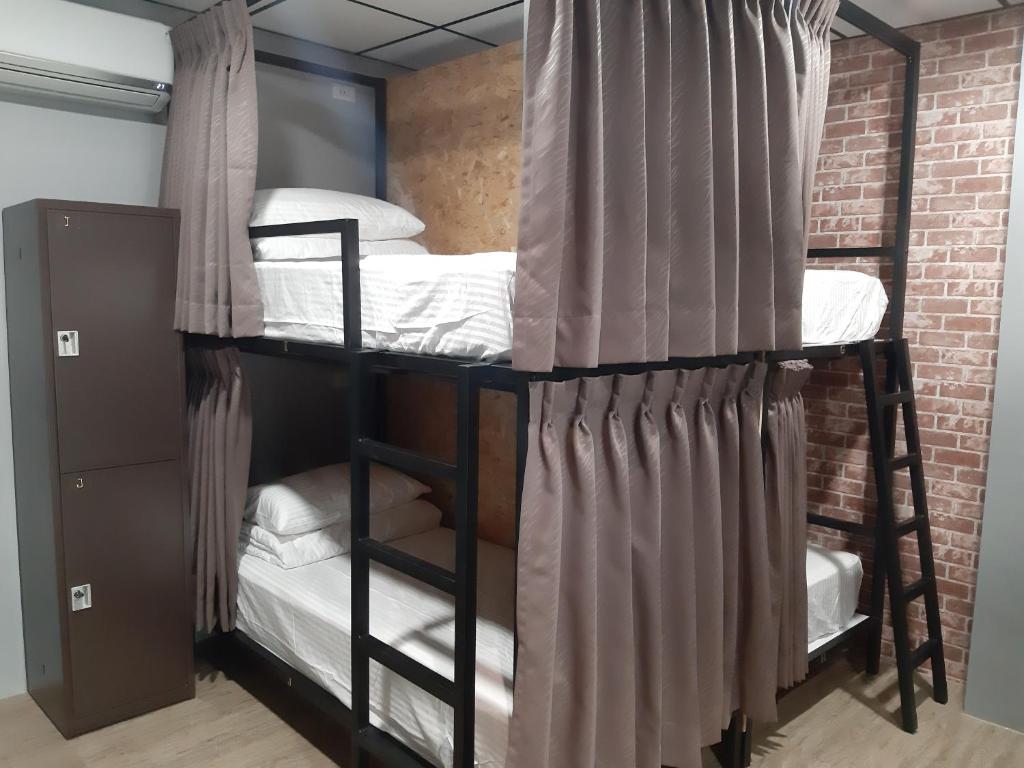 Postel nebo postele na pokoji v ubytování Quiet Hostel - Minquan Inn