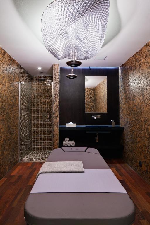 Postel nebo postele na pokoji v ubytování Miura Hotel