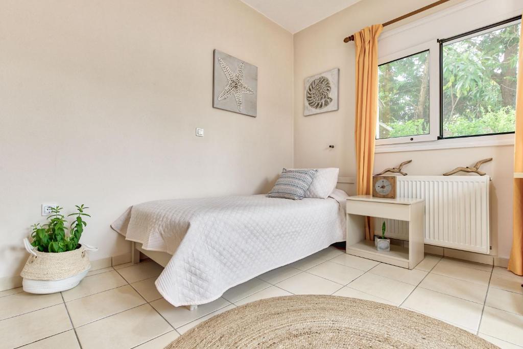 Postel nebo postele na pokoji v ubytování Villa Ancia