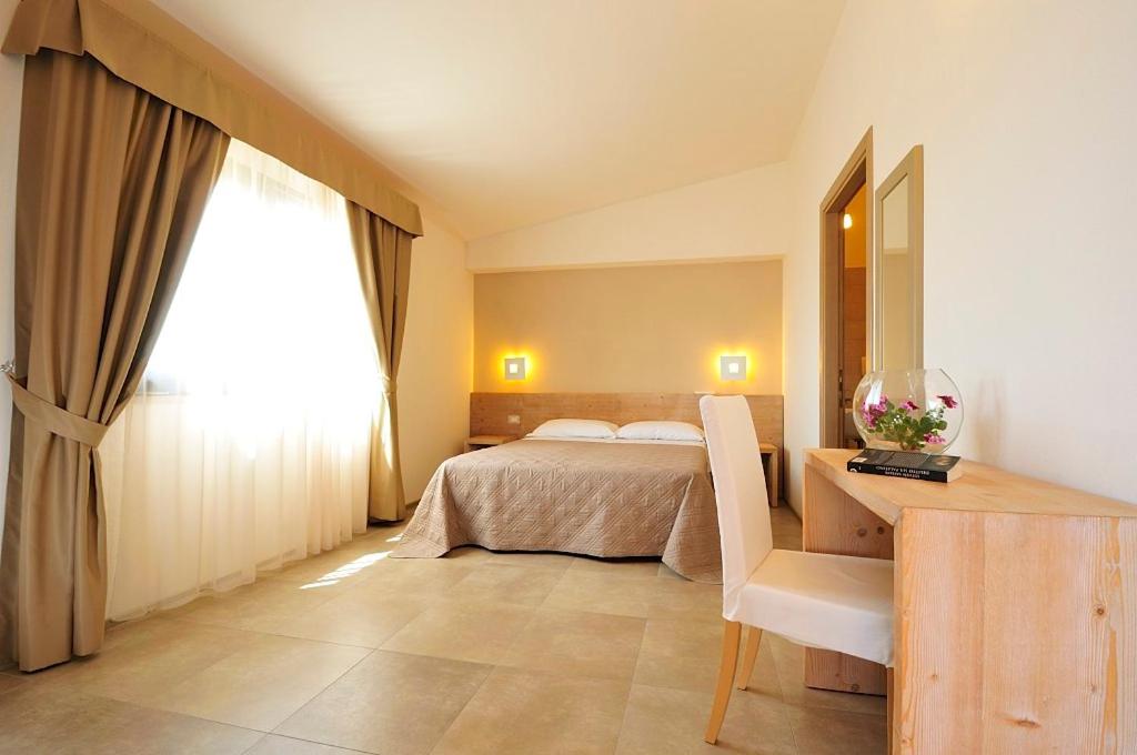 A bed or beds in a room at B&B Le Cale