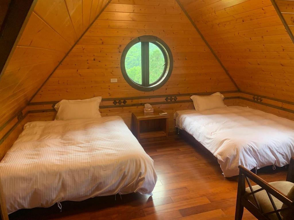 Postel nebo postele na pokoji v ubytování Rong Yuan Gu Homestay