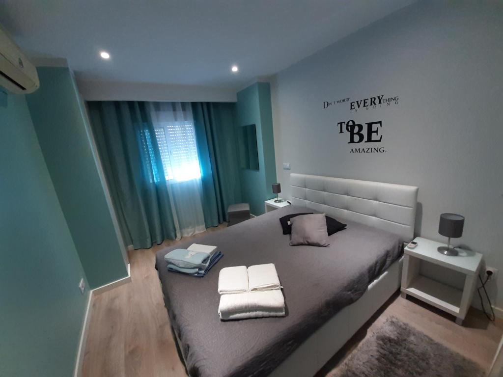 Posteľ alebo postele v izbe v ubytovaní Cosy Apartment