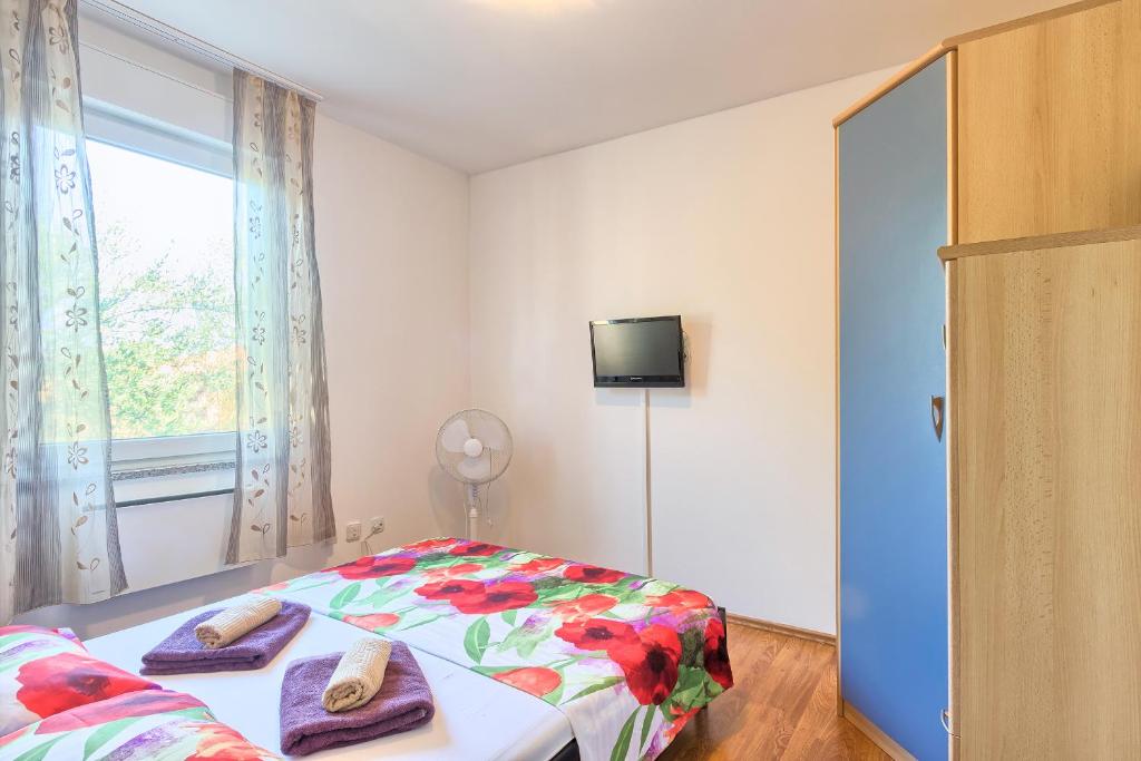 Postel nebo postele na pokoji v ubytování Holiday house Daniela