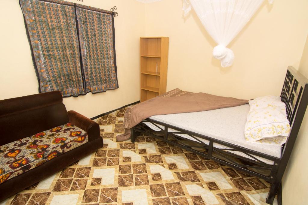 Postel nebo postele na pokoji v ubytování First Point Arusha Hostel