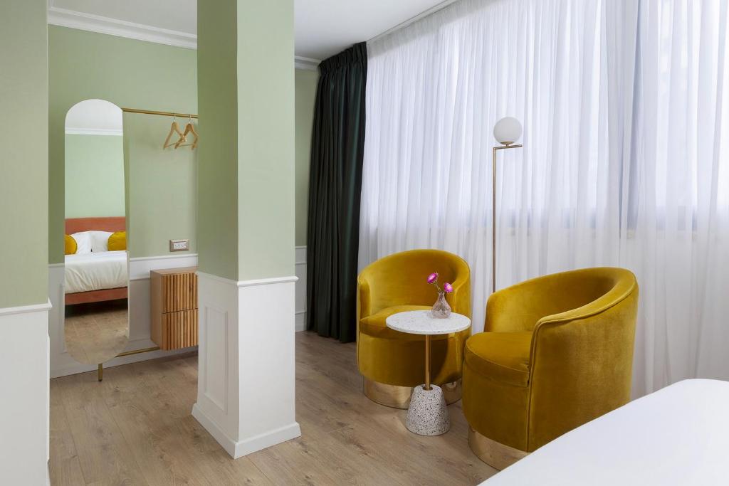 Postel nebo postele na pokoji v ubytování De Cardo Boutique