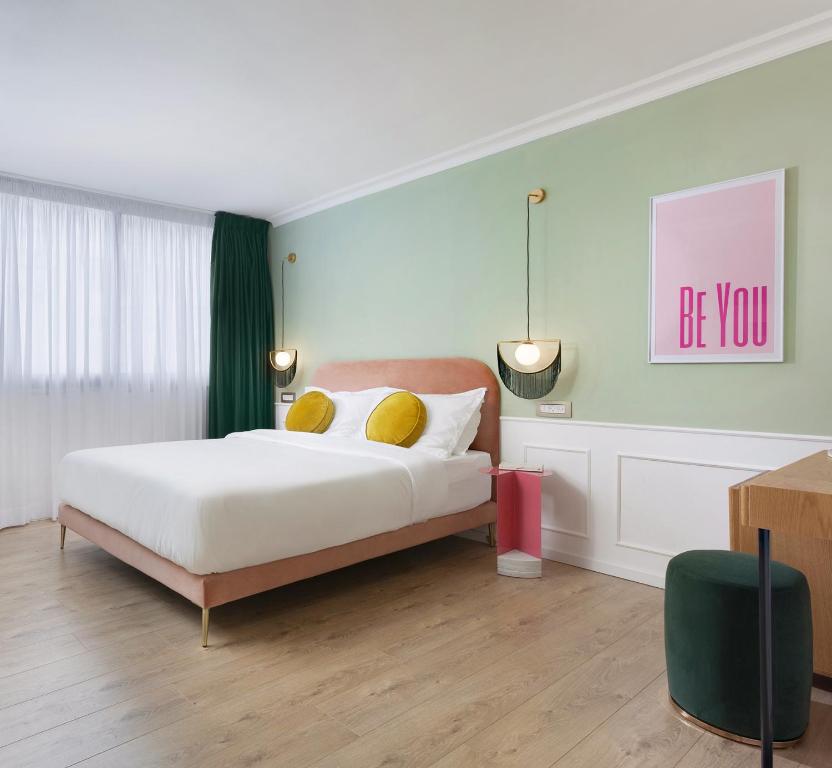 Postel nebo postele na pokoji v ubytování De Cardo Boutique