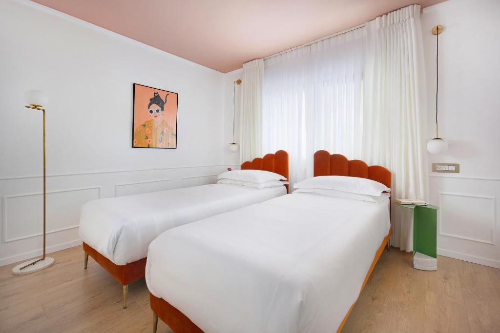 Postel nebo postele na pokoji v ubytování De Cardo Boutique