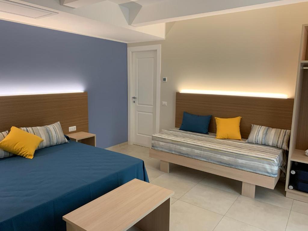 Postel nebo postele na pokoji v ubytování MaLù BEST Rooms - Tropea
