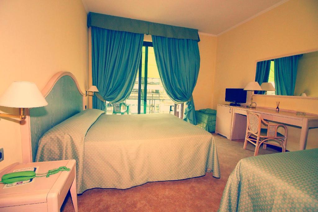 Postel nebo postele na pokoji v ubytování Hotel Siesta