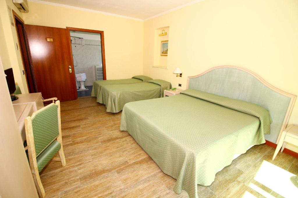 Postel nebo postele na pokoji v ubytování Hotel Siesta