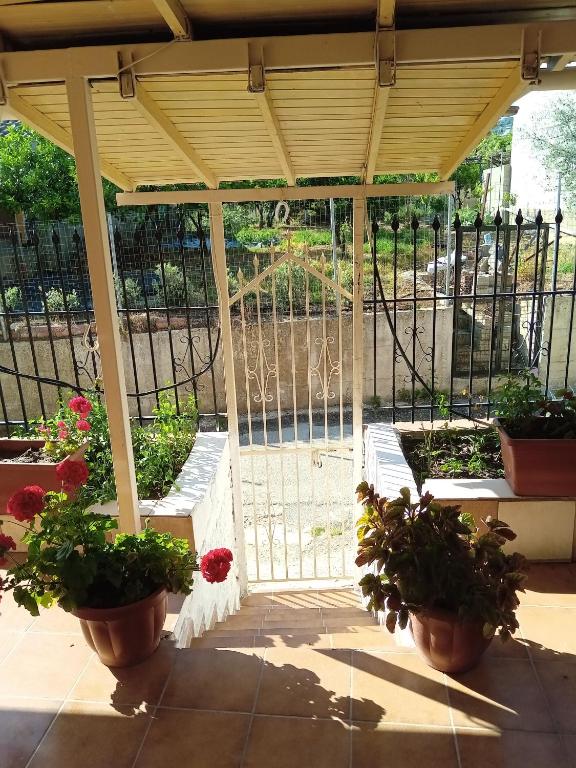 A balcony or terrace at Villa Angela, Traditional Villa in the village