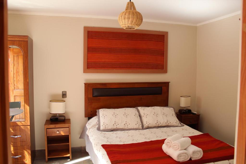 Uma cama ou camas num quarto em Vicuña Lodge