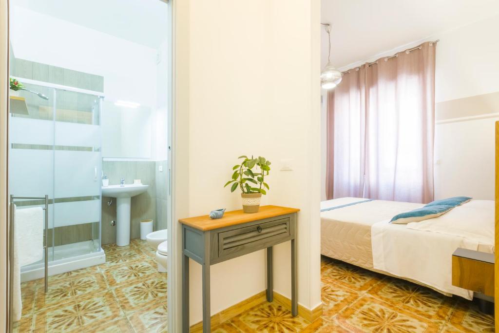 Postel nebo postele na pokoji v ubytování B&B Villa Ginevra
