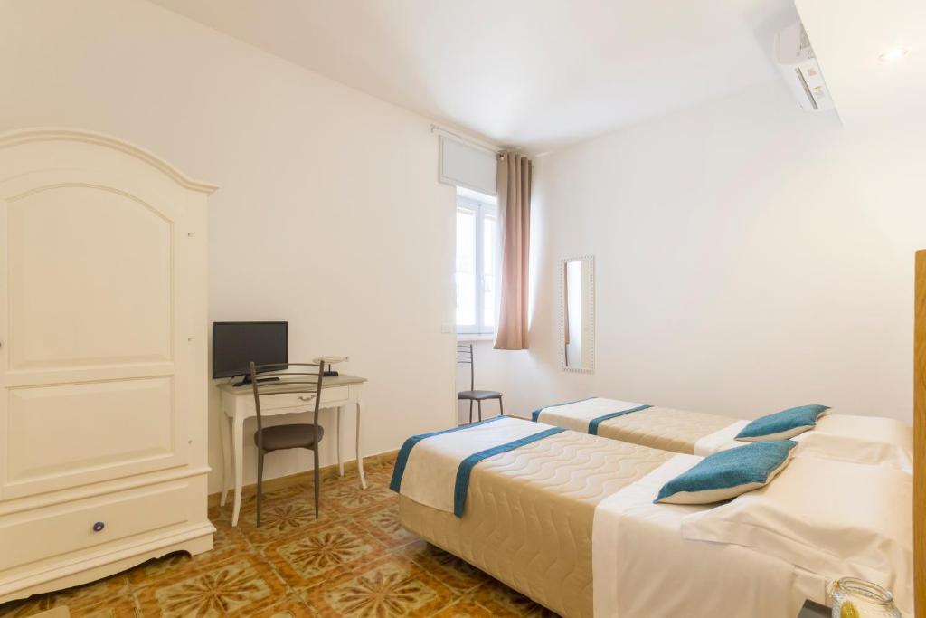 Postel nebo postele na pokoji v ubytování B&B Villa Ginevra