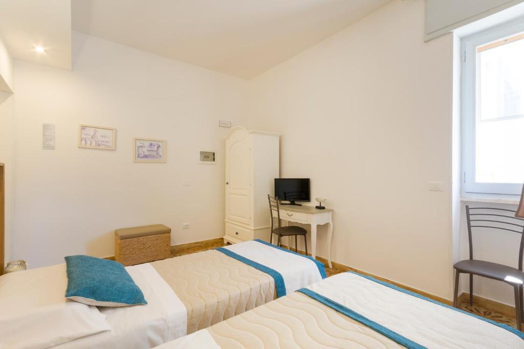 Postel nebo postele na pokoji v ubytování B&B Villa Ginevra