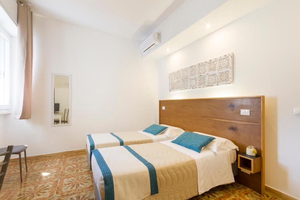 Postel nebo postele na pokoji v ubytování B&B Villa Ginevra