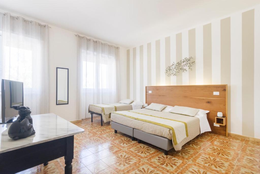 Postel nebo postele na pokoji v ubytování B&B Villa Ginevra