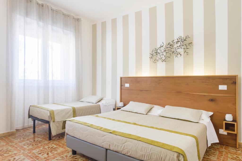 Postel nebo postele na pokoji v ubytování B&B Villa Ginevra