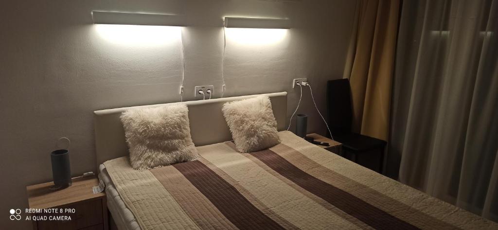 Posteľ alebo postele v izbe v ubytovaní Sunshine 208 apartman