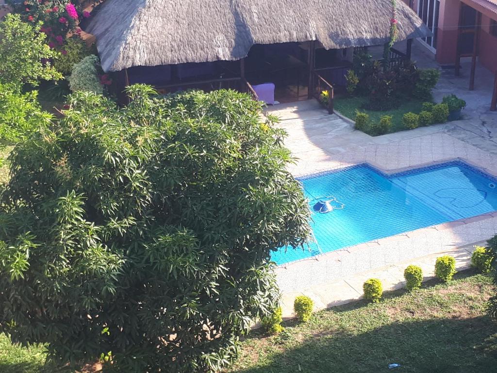 an overhead view of a swimming pool next to a house at Sparkle Guest House - Self-Catering, Pool, Garden in Maputo