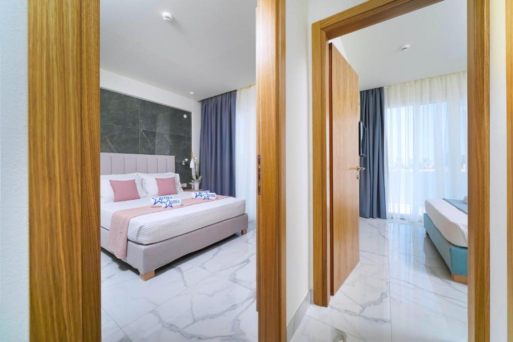 Postel nebo postele na pokoji v ubytování Hotel ASTERA