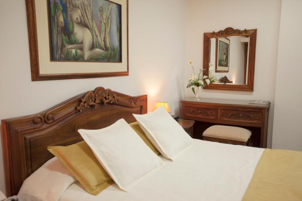 Postel nebo postele na pokoji v ubytování El Gran Hotel de Pereira
