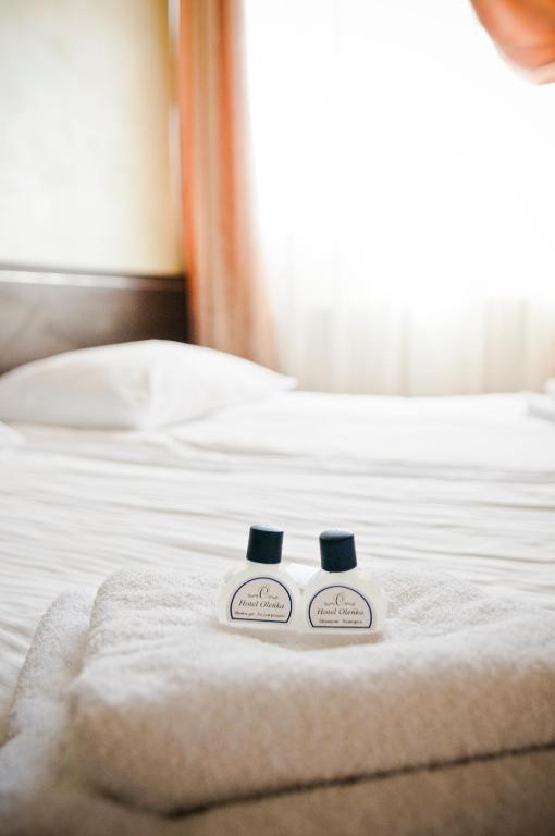 Postel nebo postele na pokoji v ubytování Hotel Oleńka