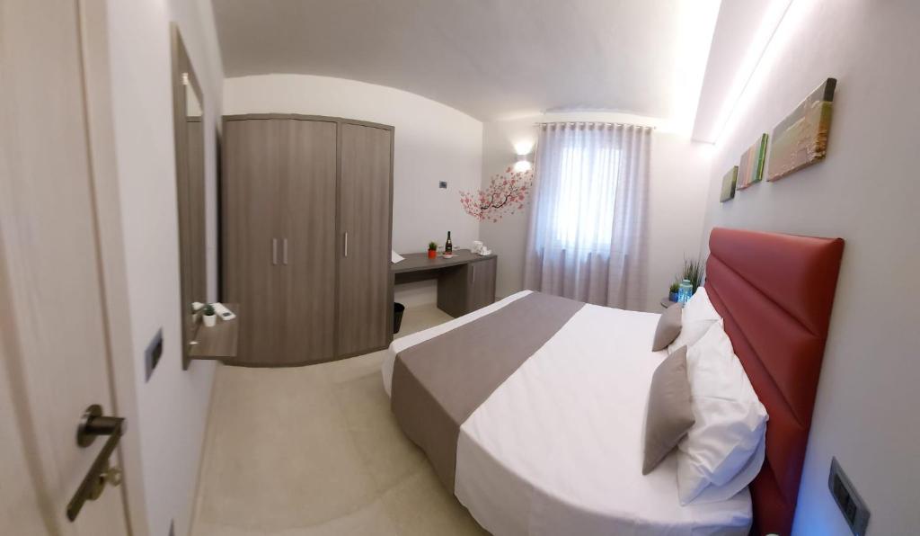 Posteľ alebo postele v izbe v ubytovaní Casa Vacanze Piccolpasso 20