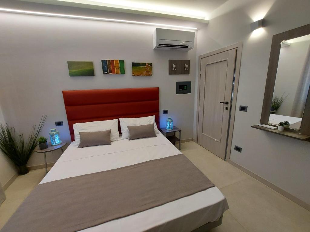 Posteľ alebo postele v izbe v ubytovaní Casa Vacanze Piccolpasso 20
