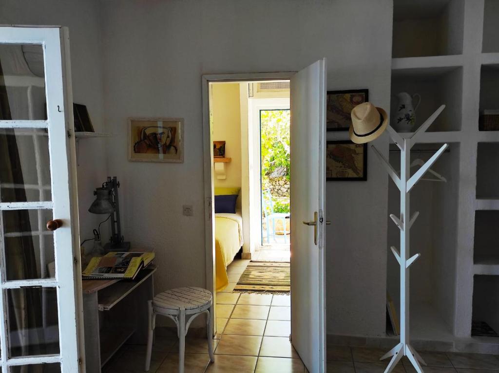 a hallway with a door open to a room at Getaway house Gundula in Podstražje
