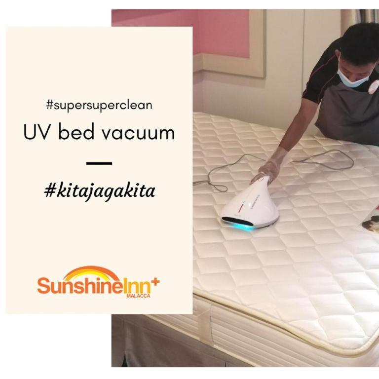 Postel nebo postele na pokoji v ubytování Sunshine Inn Plus