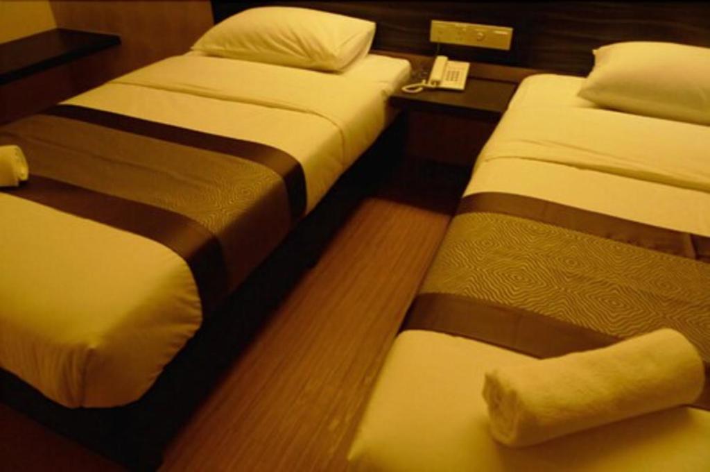 Postel nebo postele na pokoji v ubytování Hotel Austin Paradise