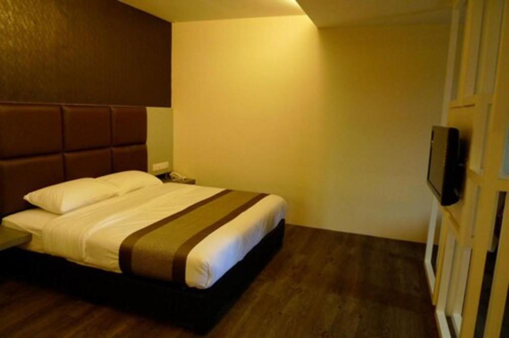 Postel nebo postele na pokoji v ubytování Hotel Austin Paradise
