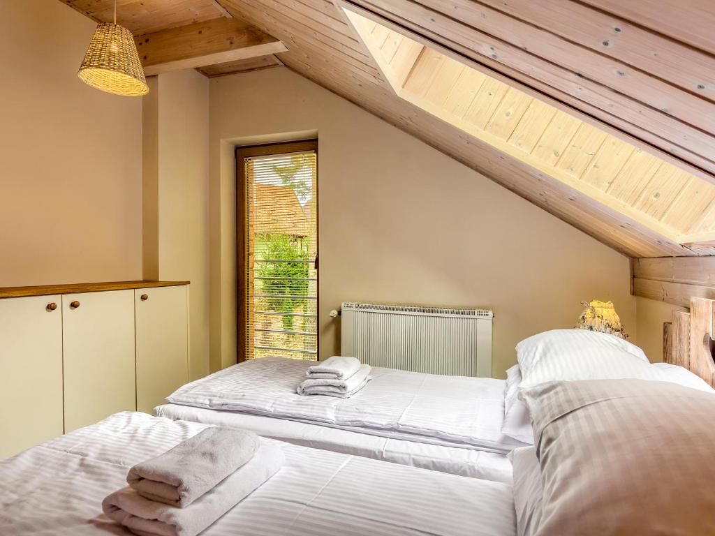 Cama ou camas em um quarto em Mazursko - domy