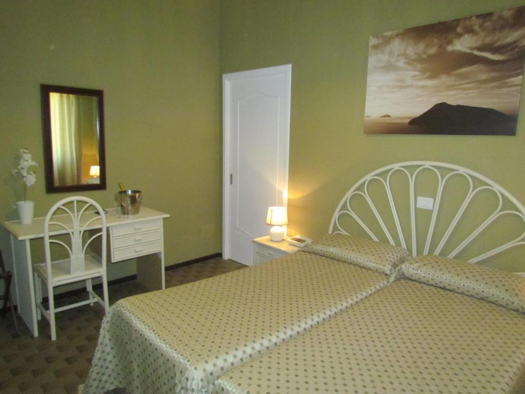 Postel nebo postele na pokoji v ubytování Pietra Pomice Hotel