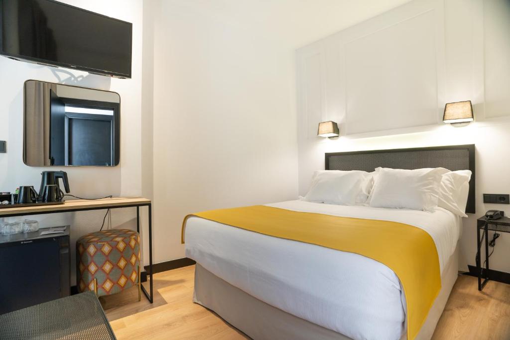 Postel nebo postele na pokoji v ubytování Hotel Boutique Puerta de las Granadas