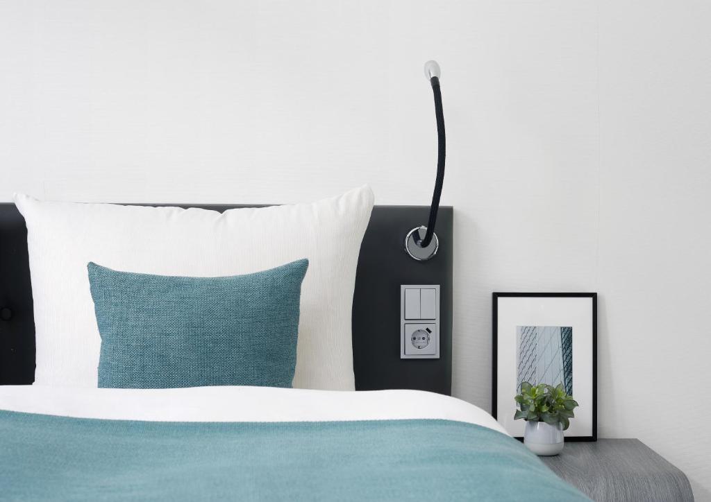 Postel nebo postele na pokoji v ubytování Living Hotel Kaiser Franz Joseph