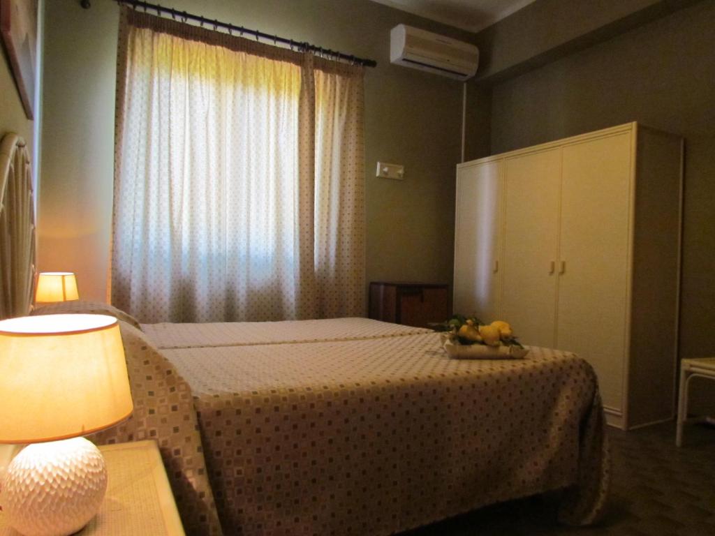 Postel nebo postele na pokoji v ubytování Pietra Pomice Hotel