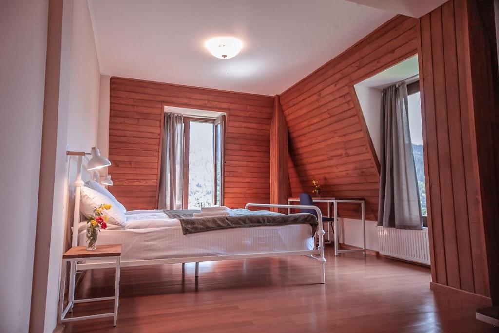 Postel nebo postele na pokoji v ubytování Latour Mestia