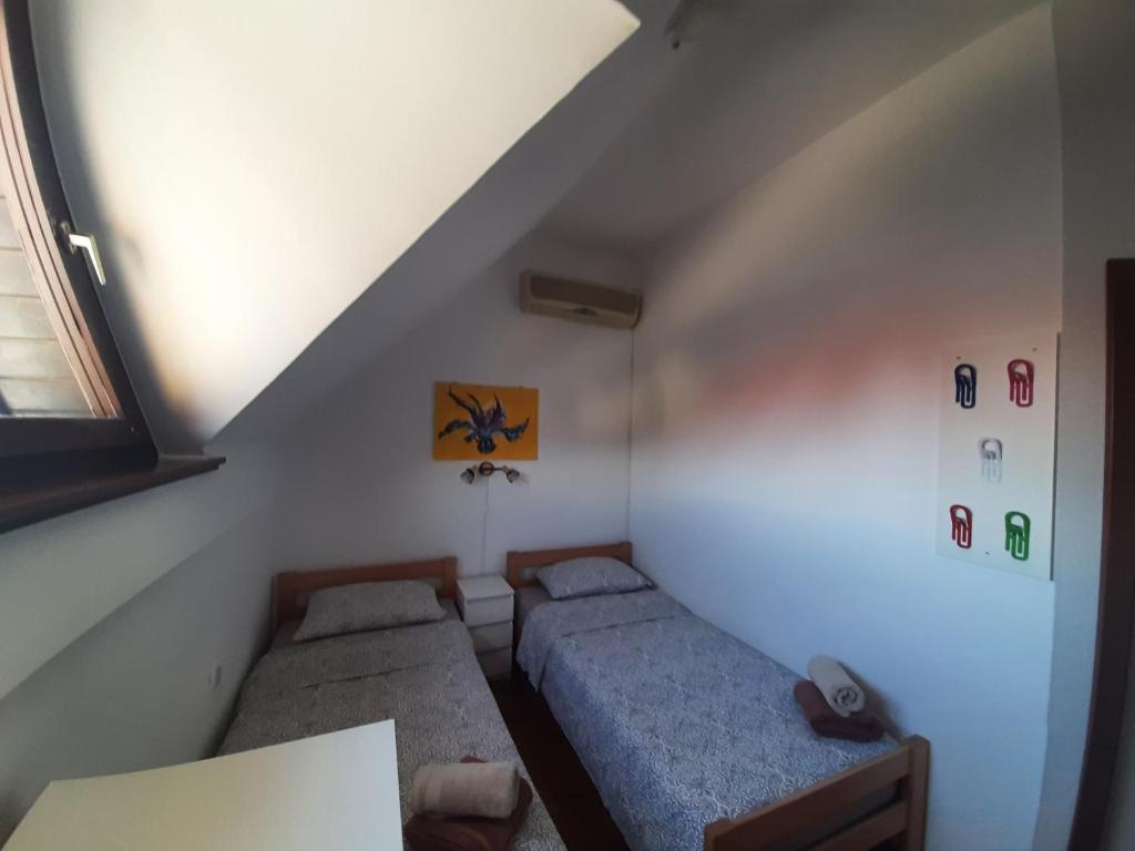 Postel nebo postele na pokoji v ubytování Apartment Terme Čatež VIP 145