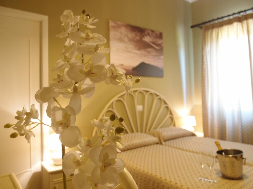 Postel nebo postele na pokoji v ubytování Pietra Pomice Hotel