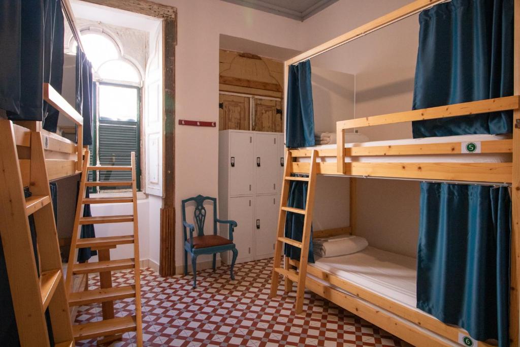 Postel nebo postele na pokoji v ubytování Tilia Hostel