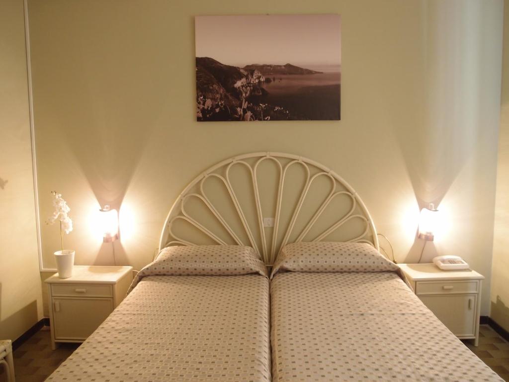 Postel nebo postele na pokoji v ubytování Pietra Pomice Hotel