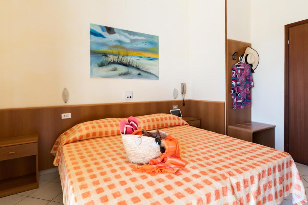 Postel nebo postele na pokoji v ubytování Albergo Rosa & Cosetta