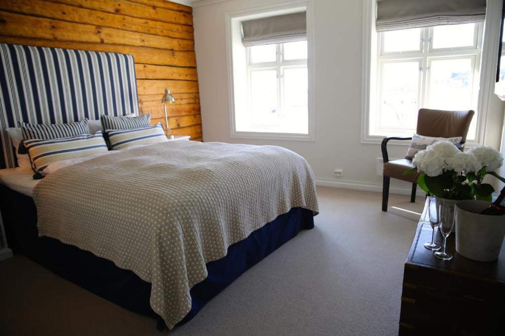 Postel nebo postele na pokoji v ubytování Rederiet Hotel