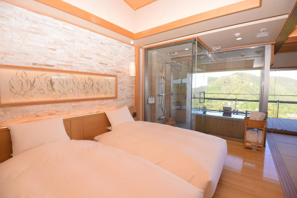 Postel nebo postele na pokoji v ubytování Gen Hakone Gora