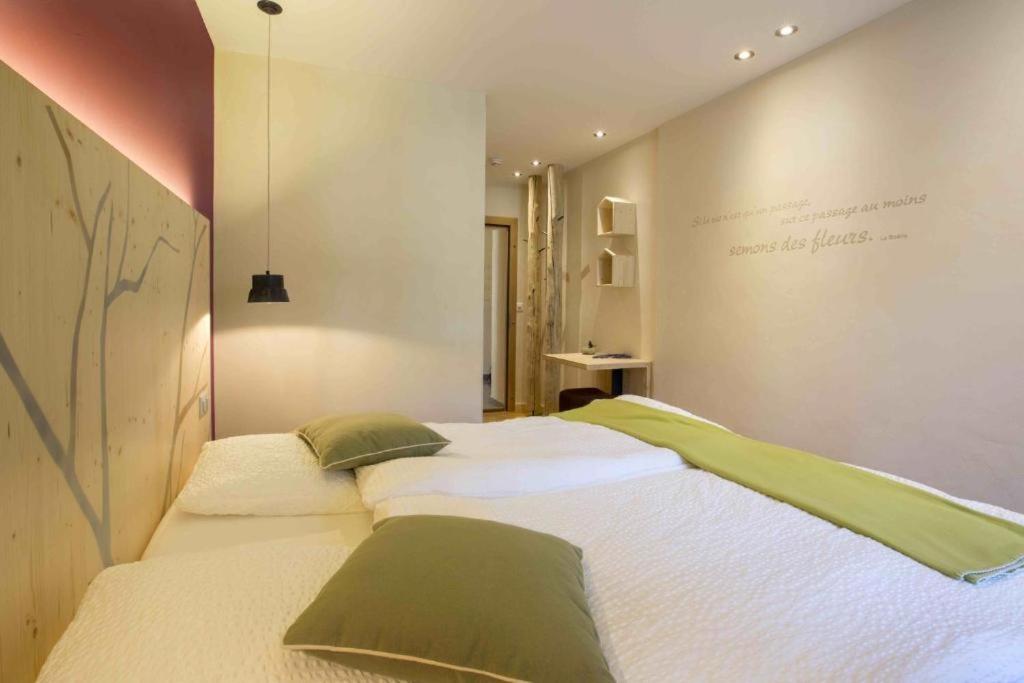 Voodi või voodid majutusasutuse Auberge de l'Hospice toas